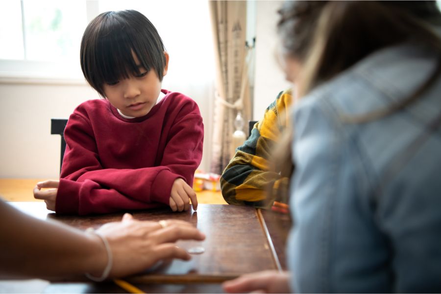 Young boy at a table learning